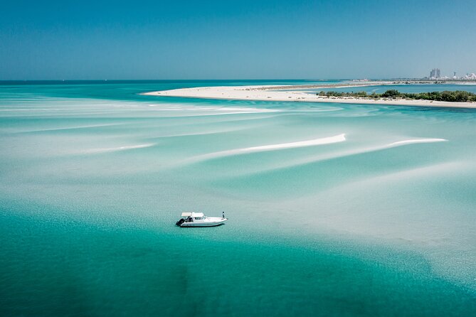 A sailboat on turquoise waters in the Caribbean Sea